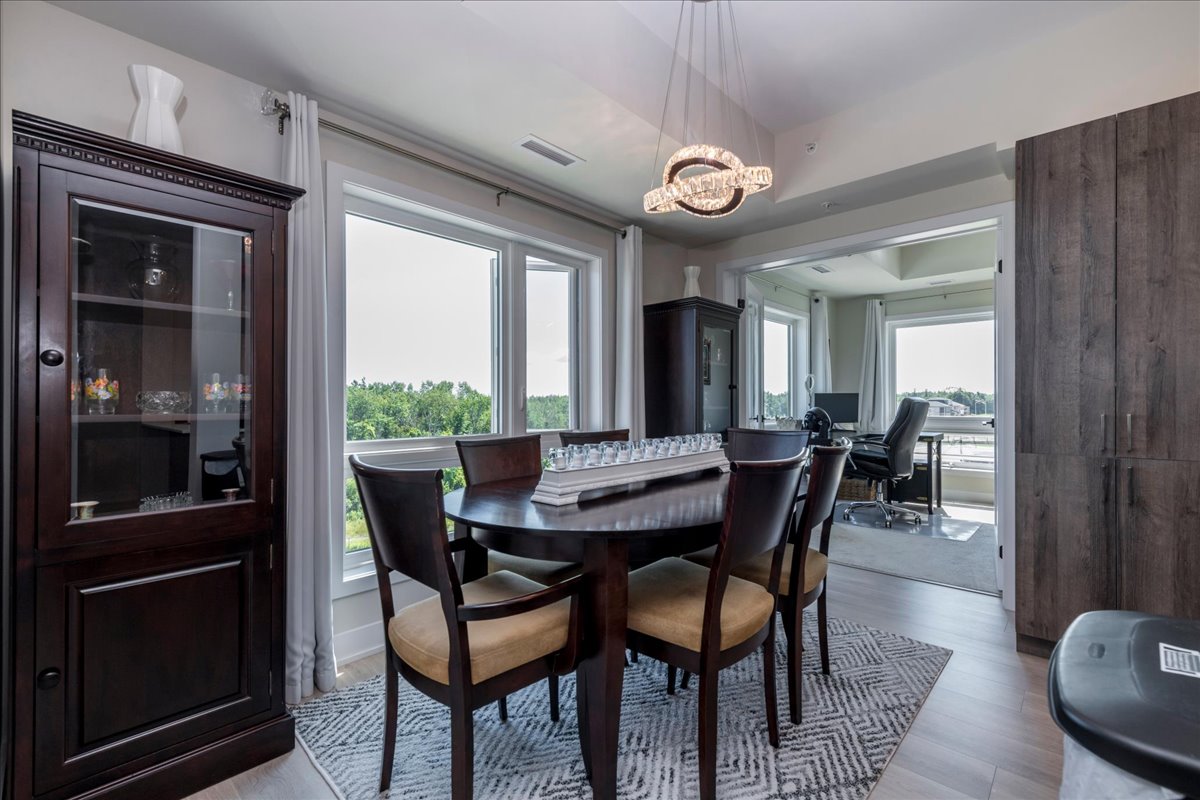 Dining room with forest views at 301 - 8 Culinary Lane, Barrie